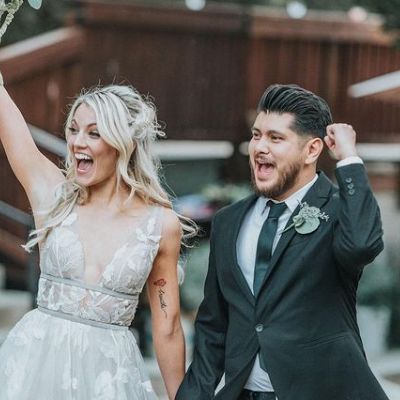 Both Clancy and JJ are smiling and waving hands.